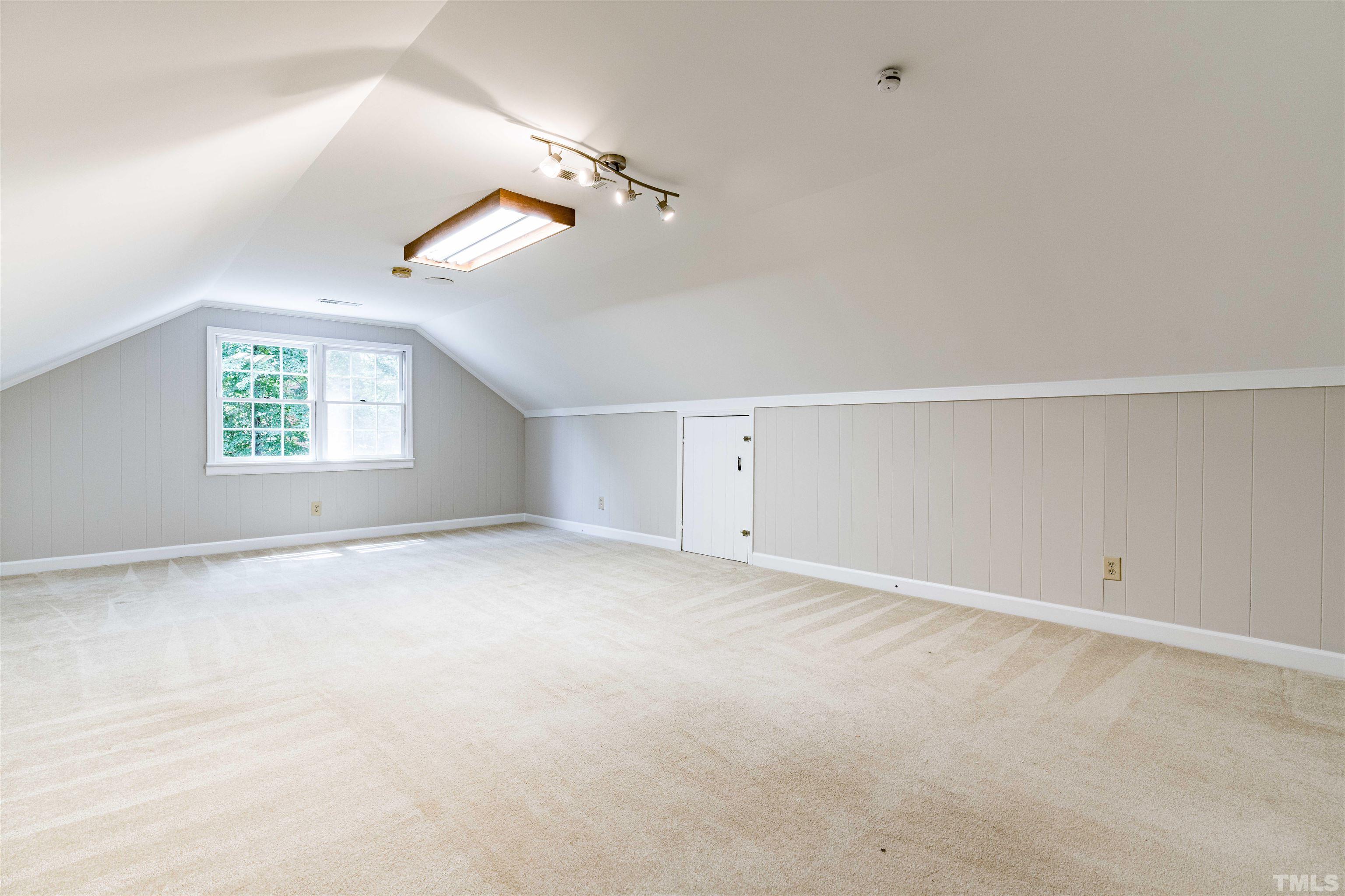 8645 Valley Brook Drive Raleigh, NC 27613 - Photo 26 of 32 an empty room with windows and ceiling fan