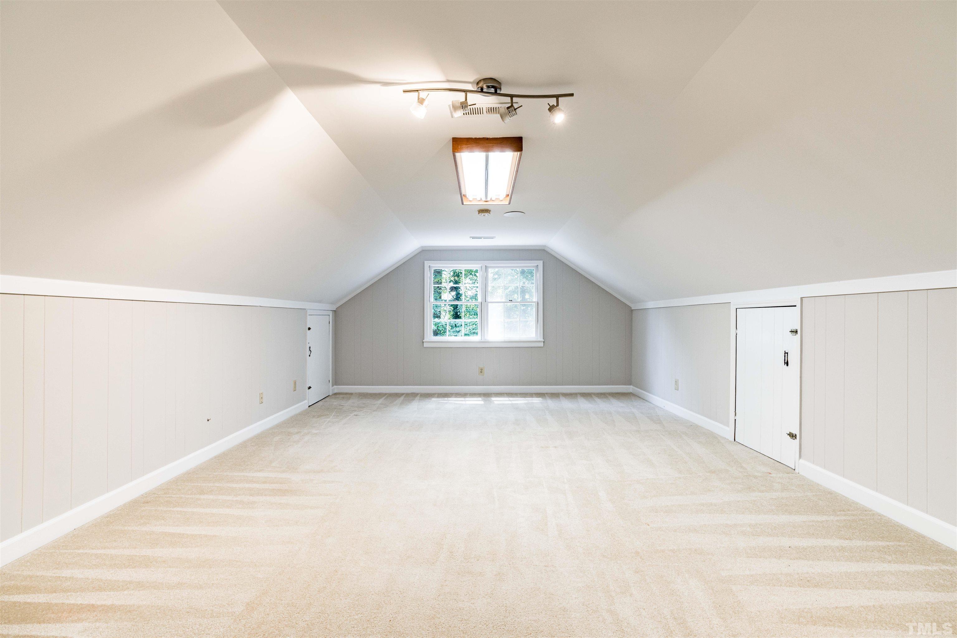 8645 Valley Brook Drive Raleigh, NC 27613 - Photo 27 of 32 a view of an empty room with a window and a kitchen