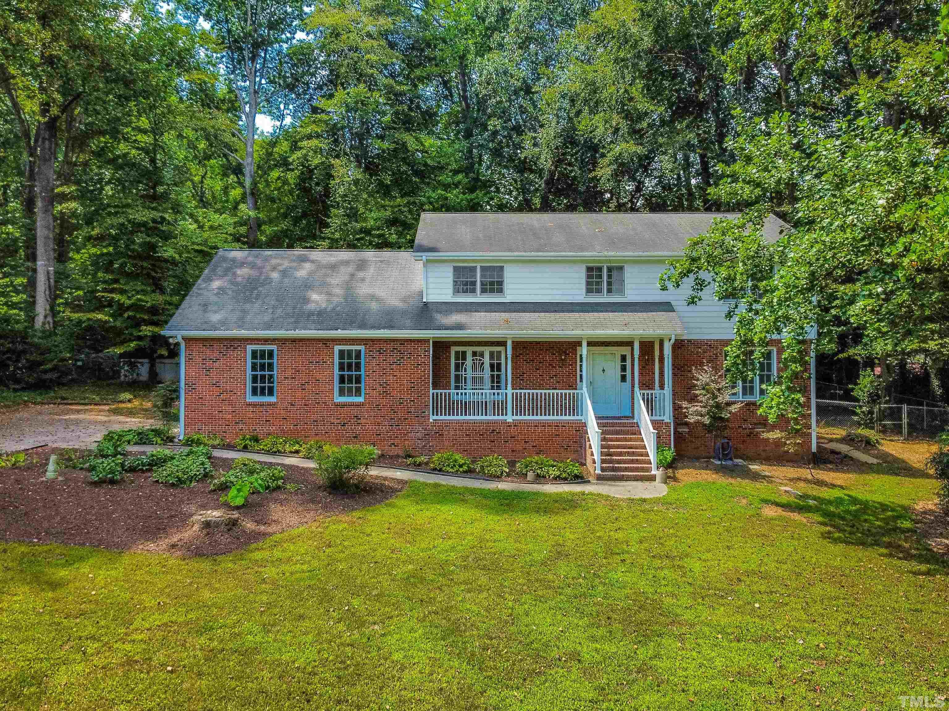 8645 Valley Brook Drive Raleigh, NC 27613 - Photo 3 of 32 front view of a house with a yard