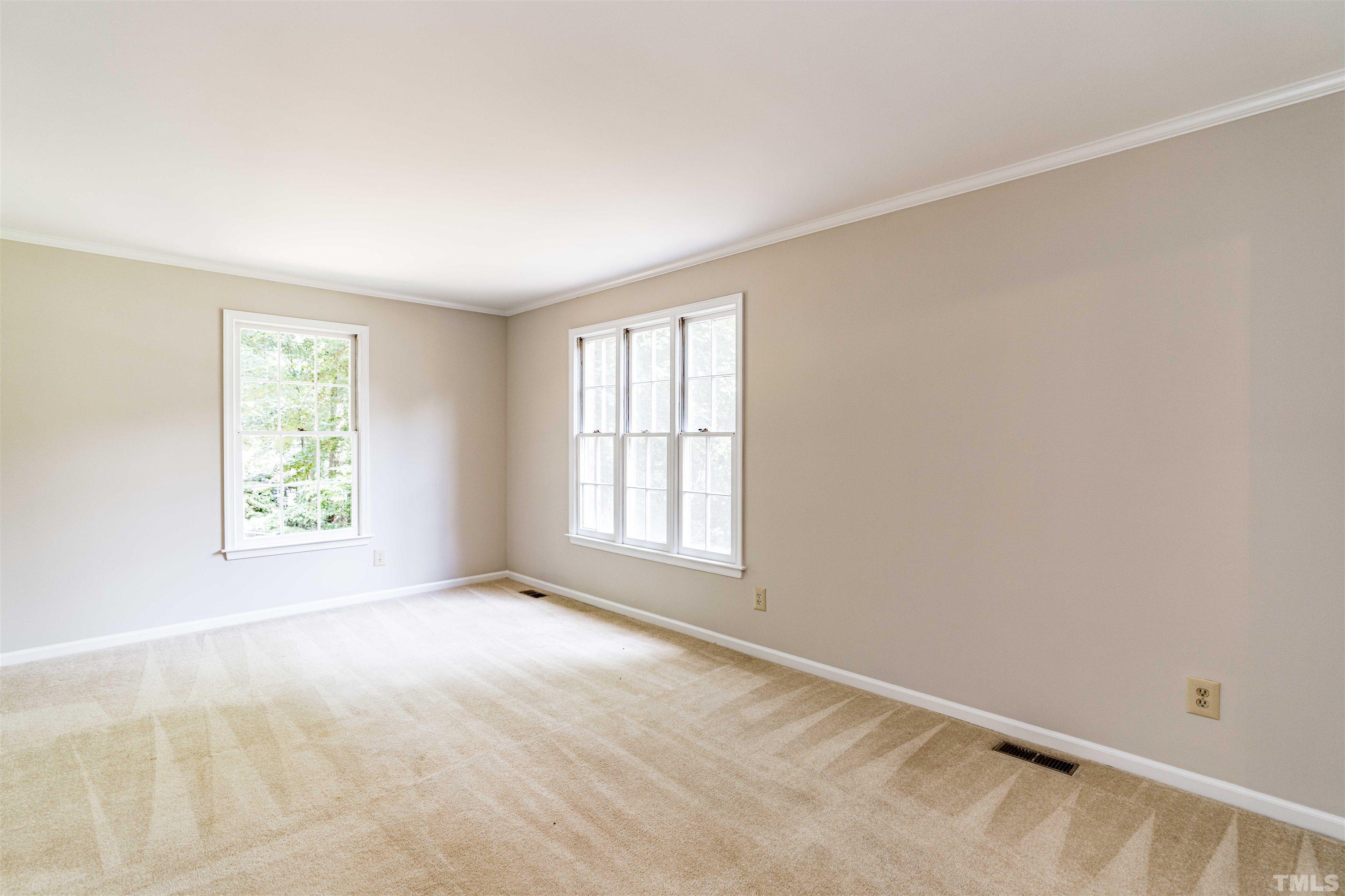 8645 Valley Brook Drive Raleigh, NC 27613 - Photo 5 of 32 a view of an empty room with a window