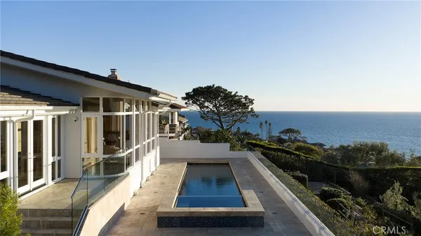 a view of a balcony with wooden floor and outdoor space