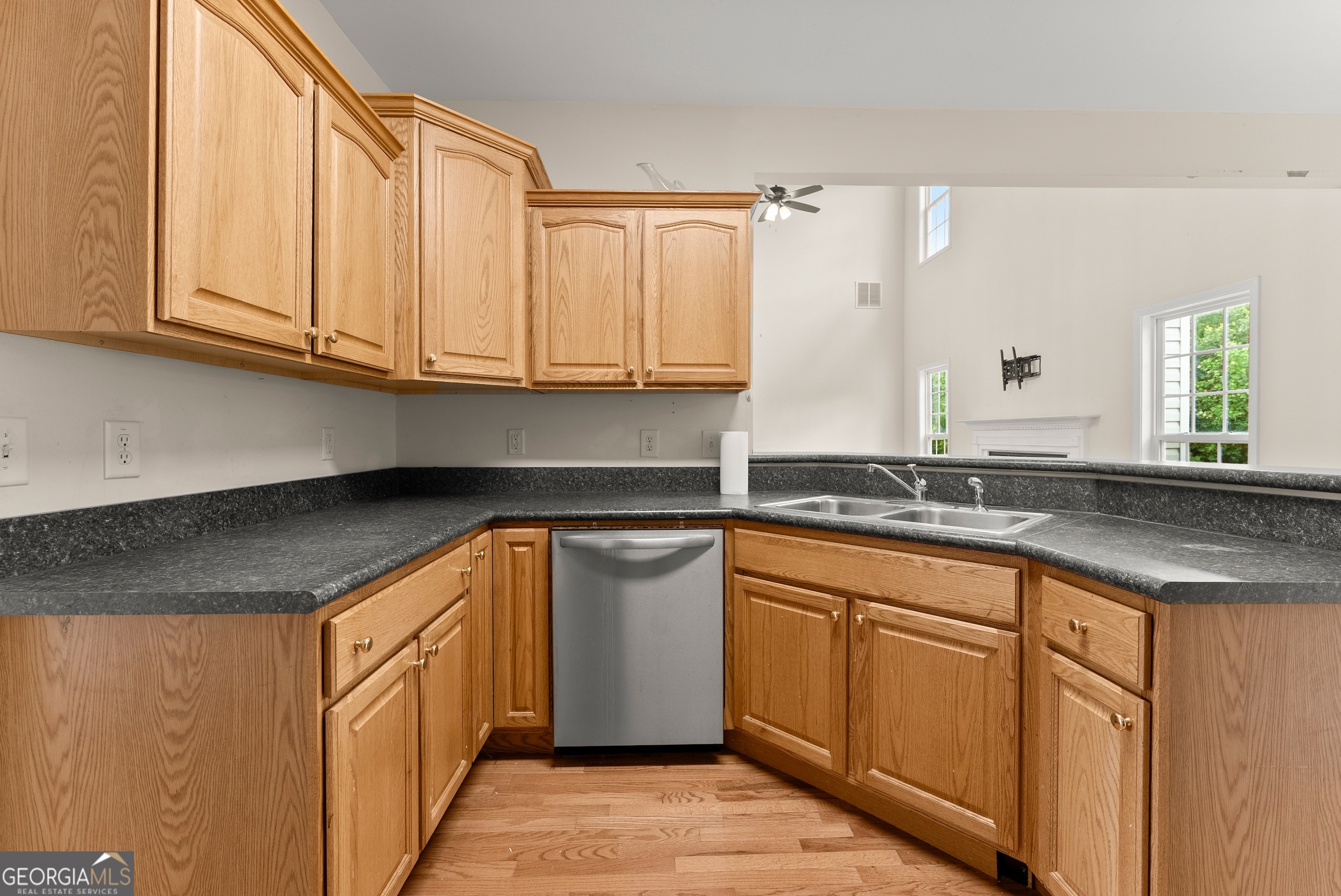 930 Heads Ferry Road Cornelia, GA 30531 - Photo 12 of 43 a kitchen with granite countertop a sink and cabinets