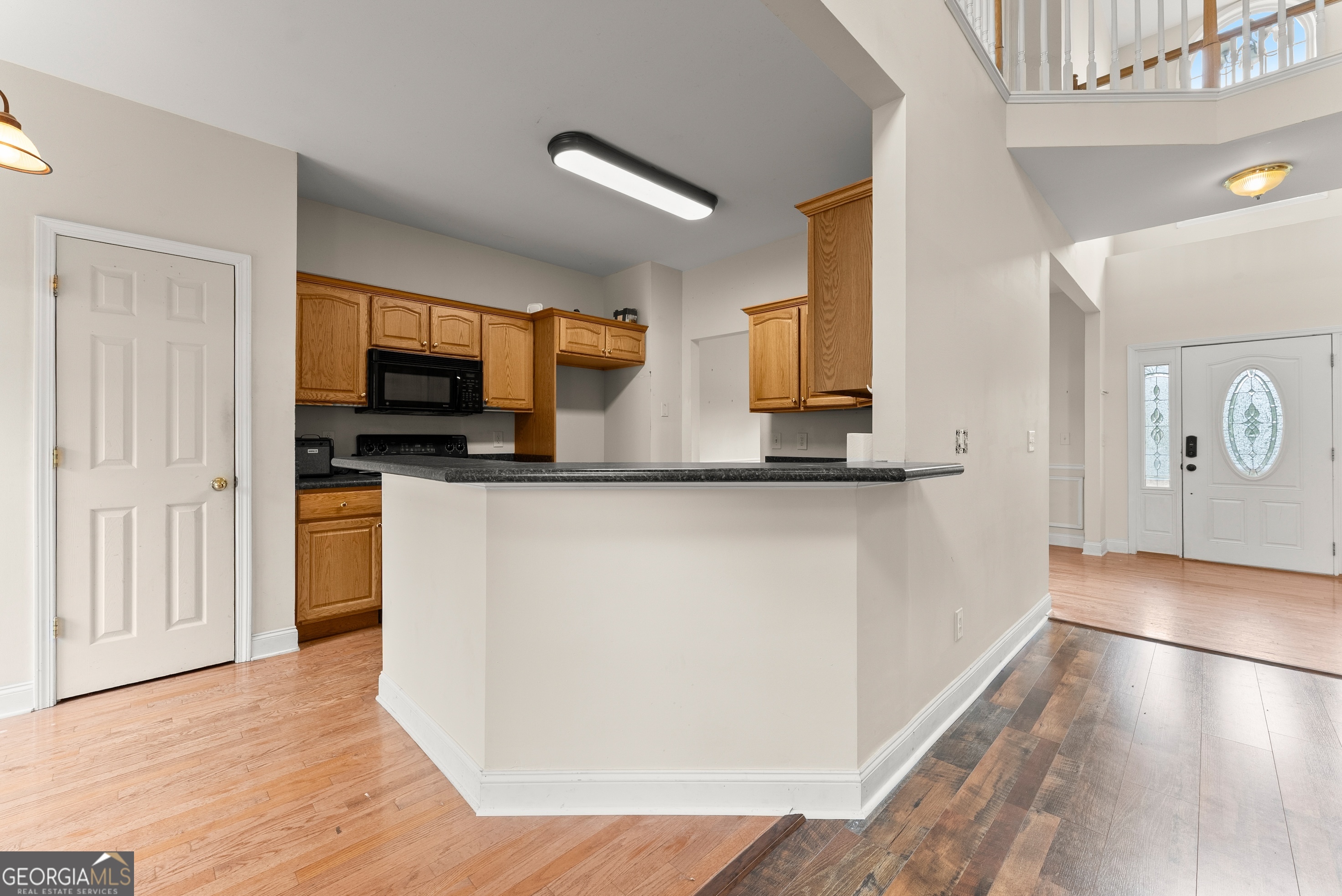 930 Heads Ferry Road Cornelia, GA 30531 - Photo 13 of 43 a kitchen with stainless steel appliances a microwave a stove and a refrigerator