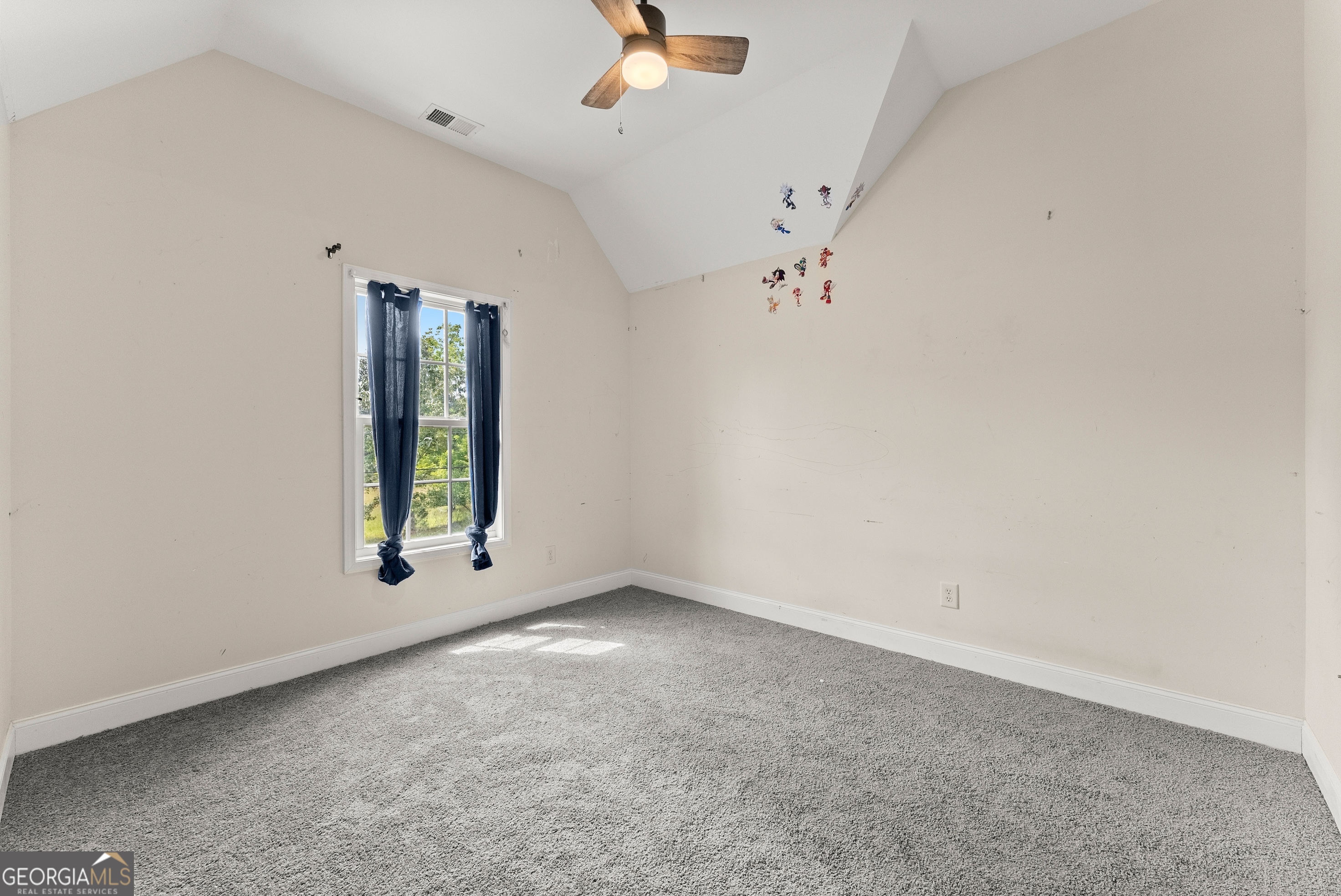 930 Heads Ferry Road Cornelia, GA 30531 - Photo 25 of 43 an empty room with a window and a ceiling fan