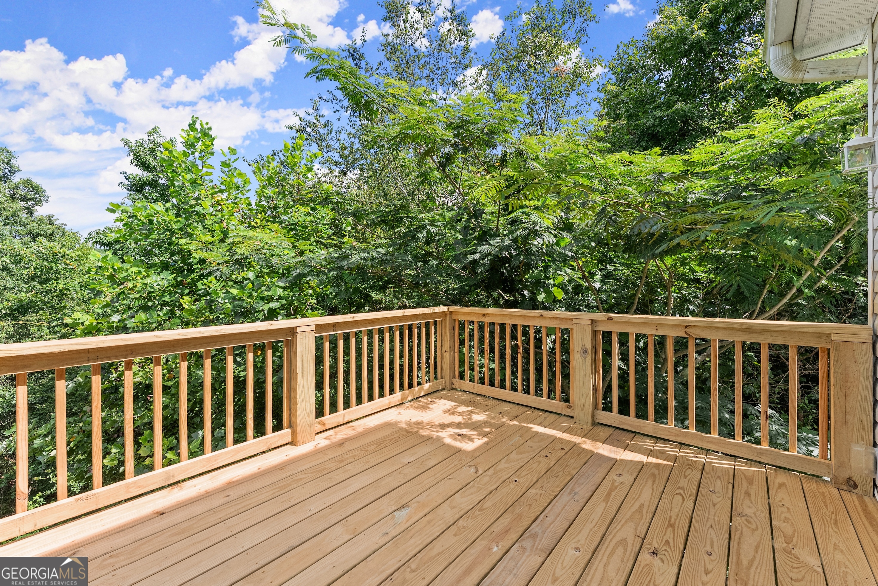 930 Heads Ferry Road Cornelia, GA 30531 - Photo 33 of 43 a balcony with wooden floor and fence