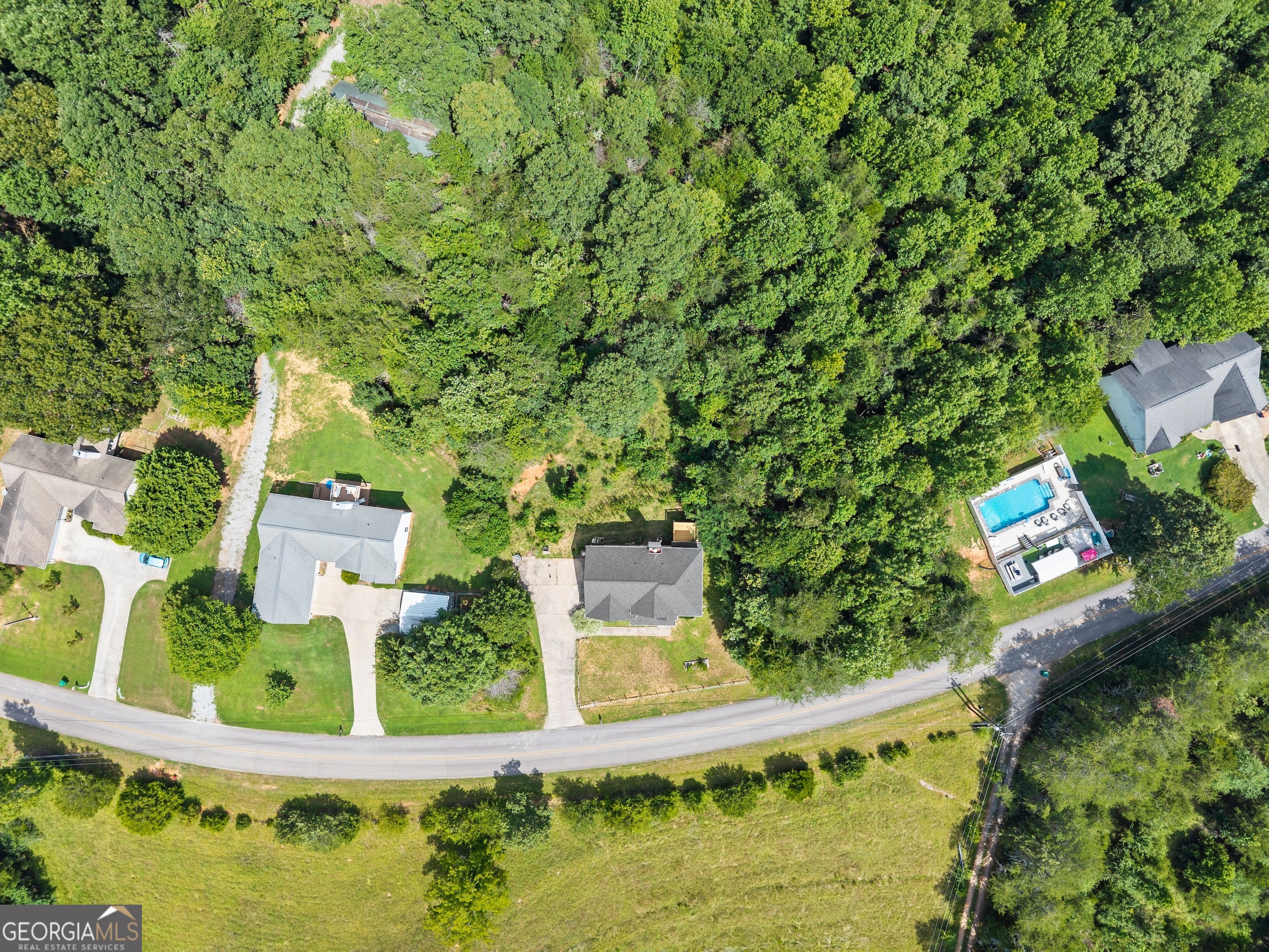 930 Heads Ferry Road Cornelia, GA 30531 - Photo 40 of 43 an aerial view of a house with swimming pool