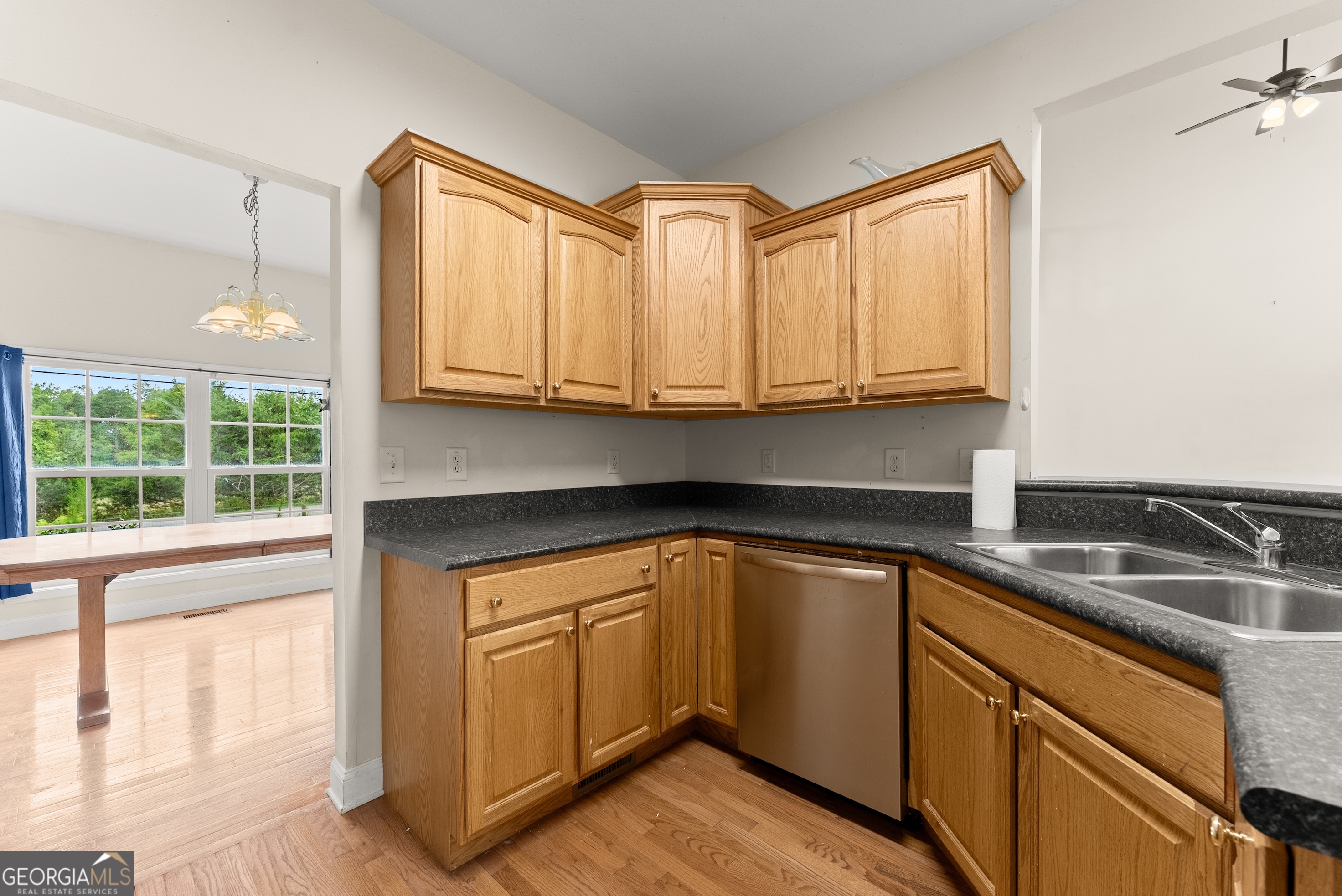 930 Heads Ferry Road Cornelia, GA 30531 - Photo 8 of 43 a kitchen with granite countertop a sink and cabinets
