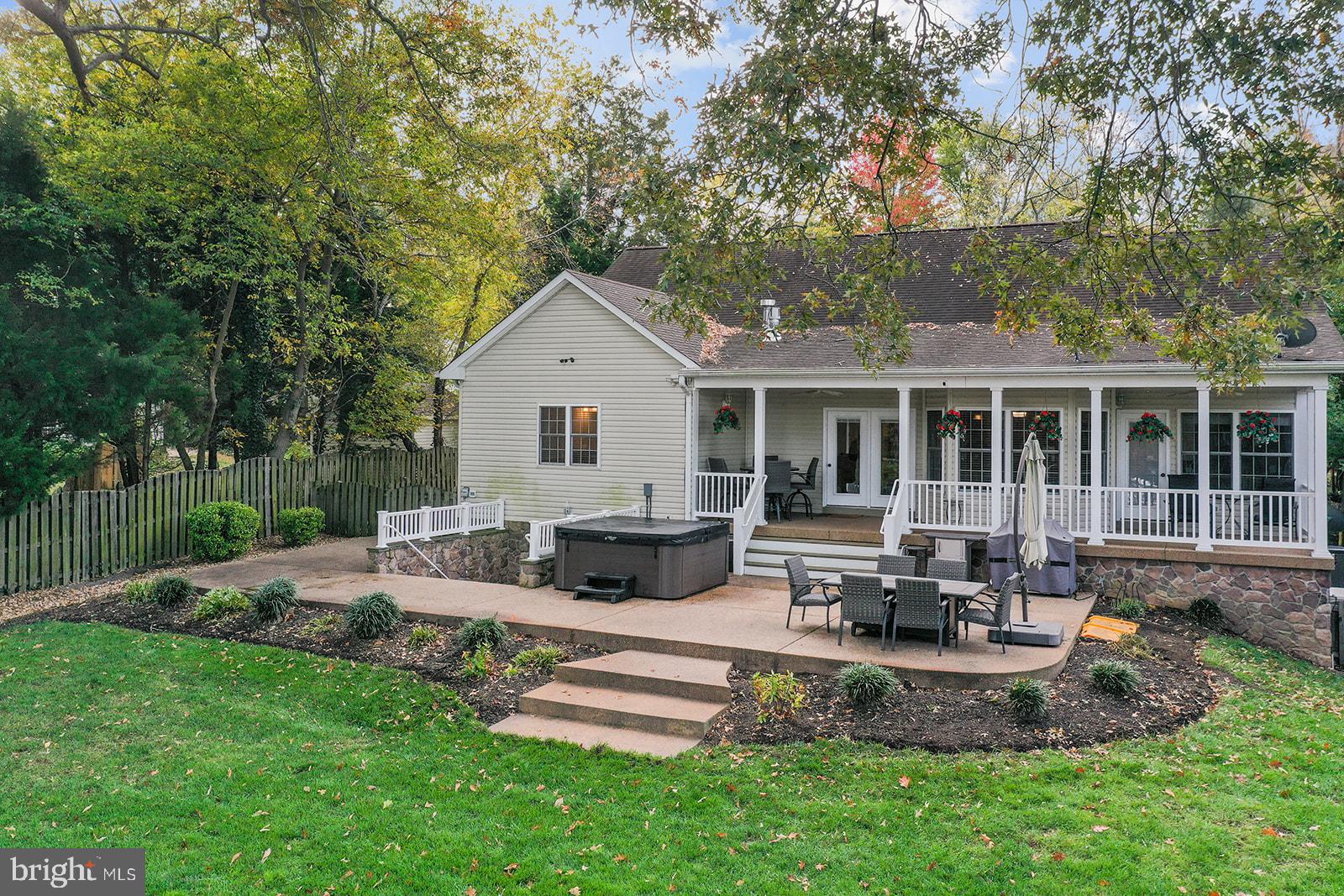 32 Dobe Point Road Stafford, VA 22554 - Photo 3 of 38 a view of a house with backyard sitting area and furniture