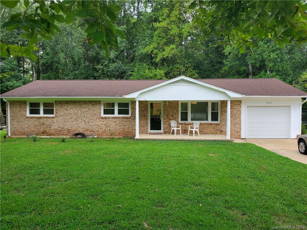 4501 Farmbrook Road Gastonia, NC 28056 - Photo 2 of 23 a front view of a house with a garden
