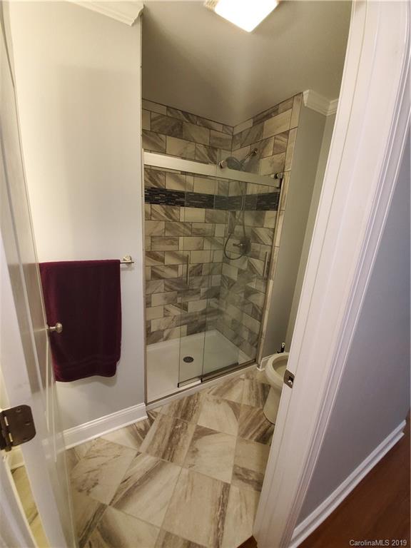 4501 Farmbrook Road Gastonia, NC 28056 - Photo 13 of 23 a bathroom with a shower and a sink