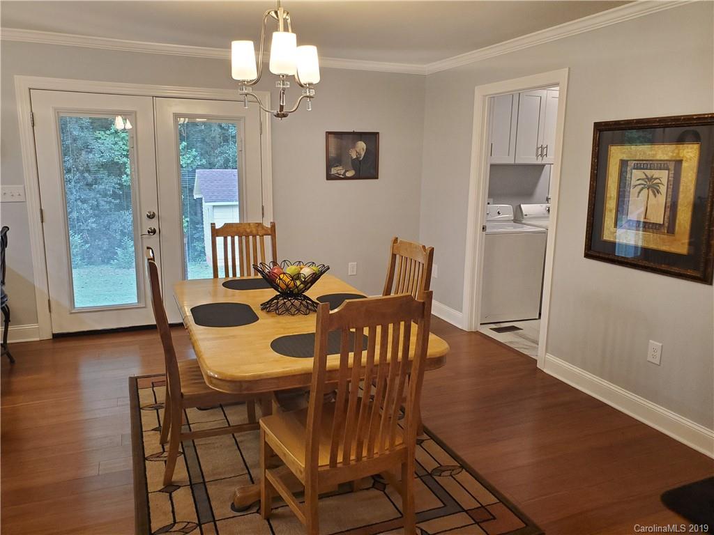 4501 Farmbrook Road Gastonia, NC 28056 - Photo 6 of 23 a view of a dining room with furniture window and wooden floor