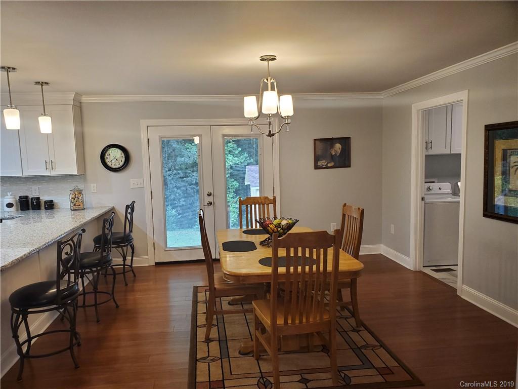 4501 Farmbrook Road Gastonia, NC 28056 - Photo 7 of 23 a view of a dining room with furniture window and wooden floor