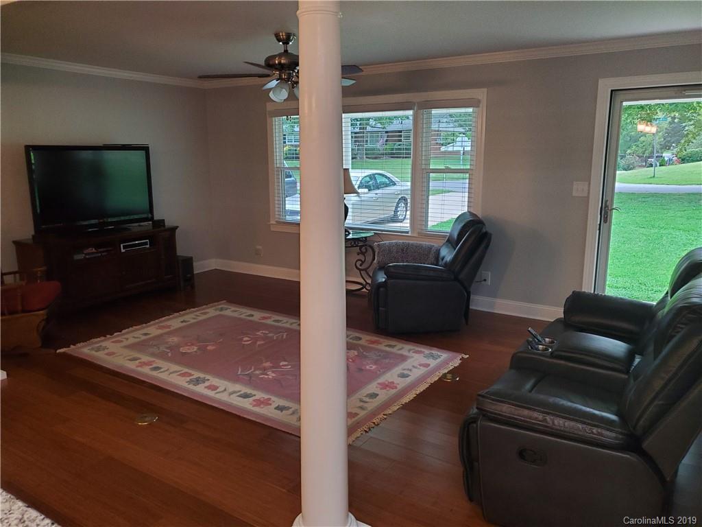 4501 Farmbrook Road Gastonia, NC 28056 - Photo 8 of 23 a living room with furniture and a flat screen tv