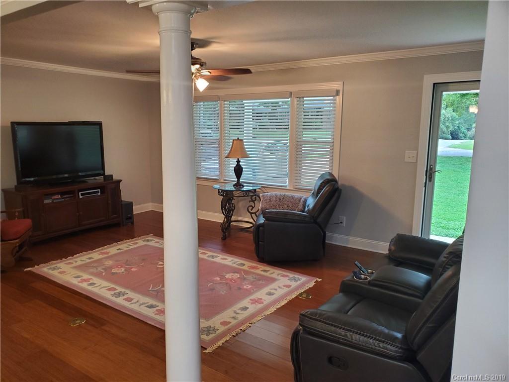 4501 Farmbrook Road Gastonia, NC 28056 - Photo 9 of 23 a living room with furniture and a flat screen tv