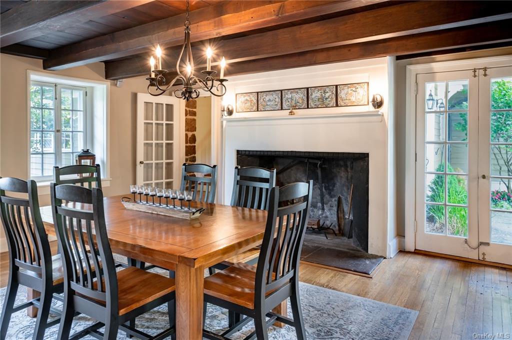 15 Sickletown Road Pearl River, NY 10965 - Photo 11 of 35 a dining room with furniture a fireplace and wooden floor