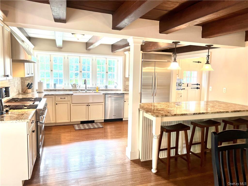 15 Sickletown Road Pearl River, NY 10965 - Photo 14 of 35 a kitchen with a stove a sink and a refrigerator