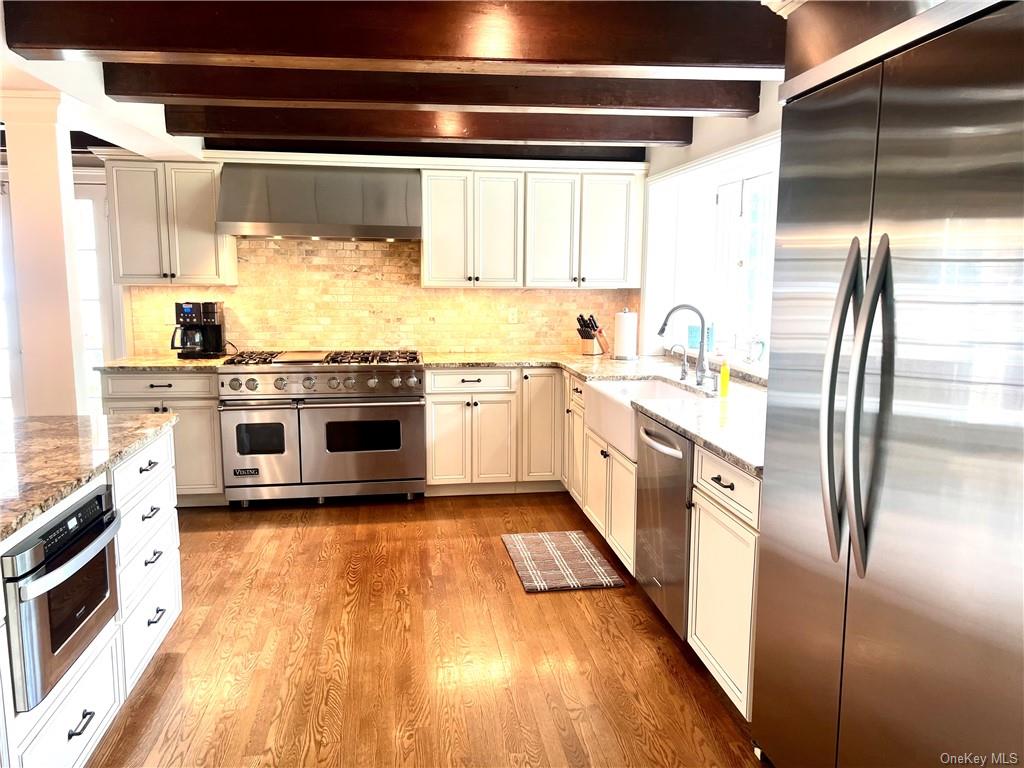 15 Sickletown Road Pearl River, NY 10965 - Photo 15 of 35 a kitchen with stainless steel appliances a stove a sink and a refrigerator