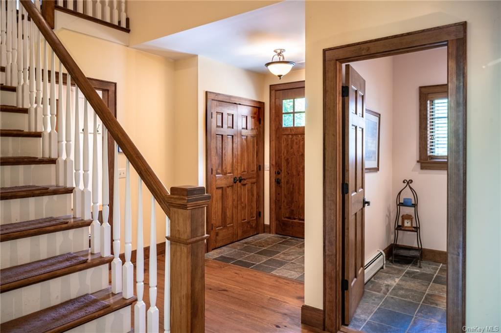 15 Sickletown Road Pearl River, NY 10965 - Photo 18 of 35 a view of a hallway with wooden floor and staircase