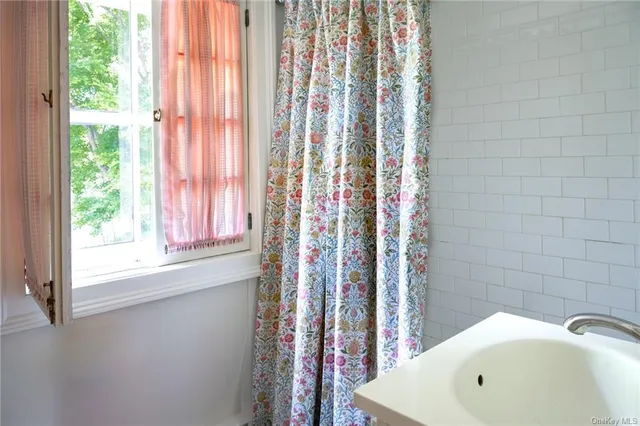 a bedroom with a bed and a chair