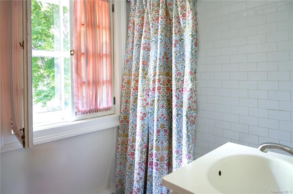 15 Sickletown Road Pearl River, NY 10965 - Photo 25 of 35 a bathroom with a bathtub and shower
