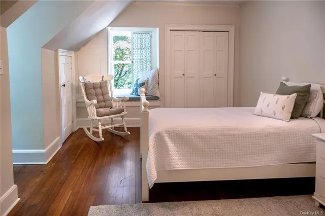 a view of staircase with wooden floor and windows