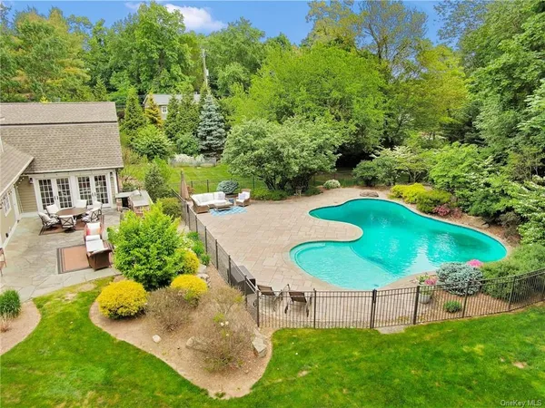 an aerial view of a house with outdoor space