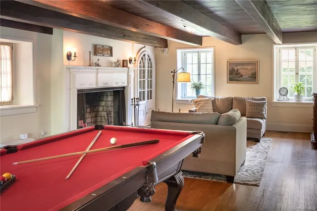 a front view of a house with large windows