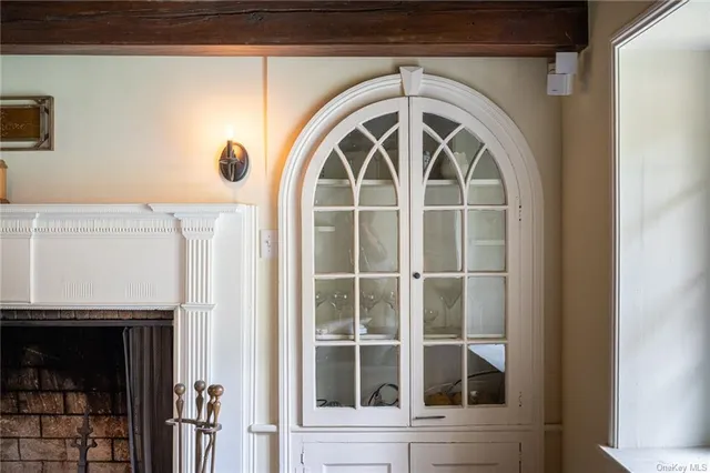 a room with furniture pool table and wooden floor