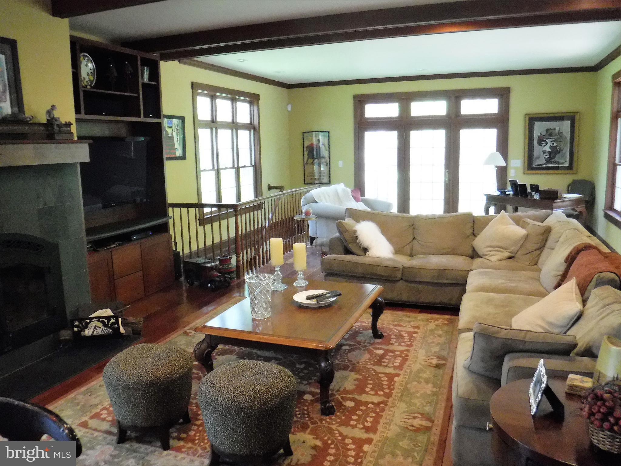 500 North Spring Mill Road Villanova, PA 19085 - Photo 14 of 35 family room with fireplace and custom built ins