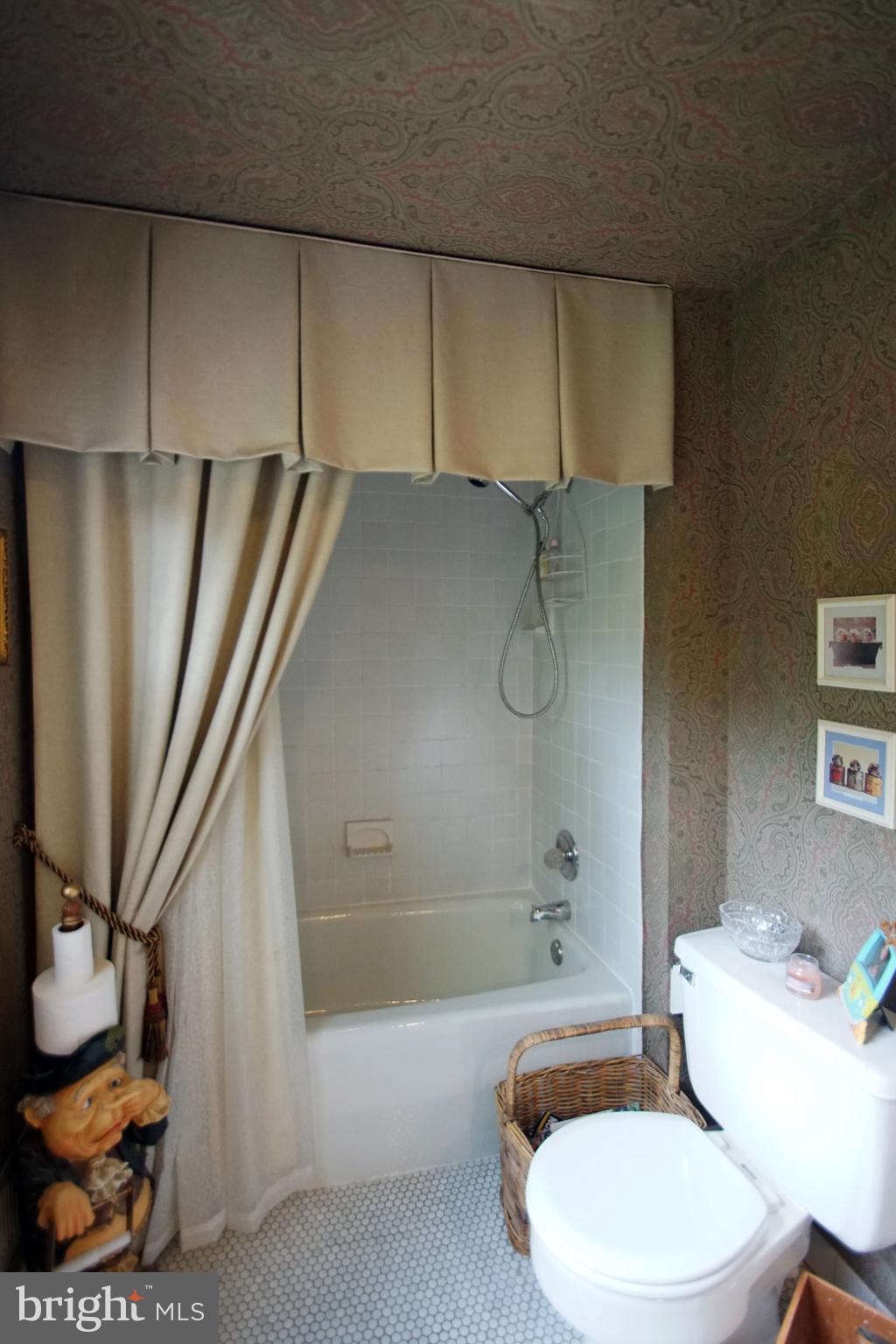 500 North Spring Mill Road Villanova, PA 19085 - Photo 30 of 35 ceramic tiled hall bath with tub/shower