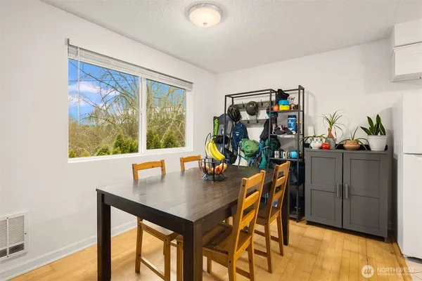 a view of a dining room with furniture and a window
