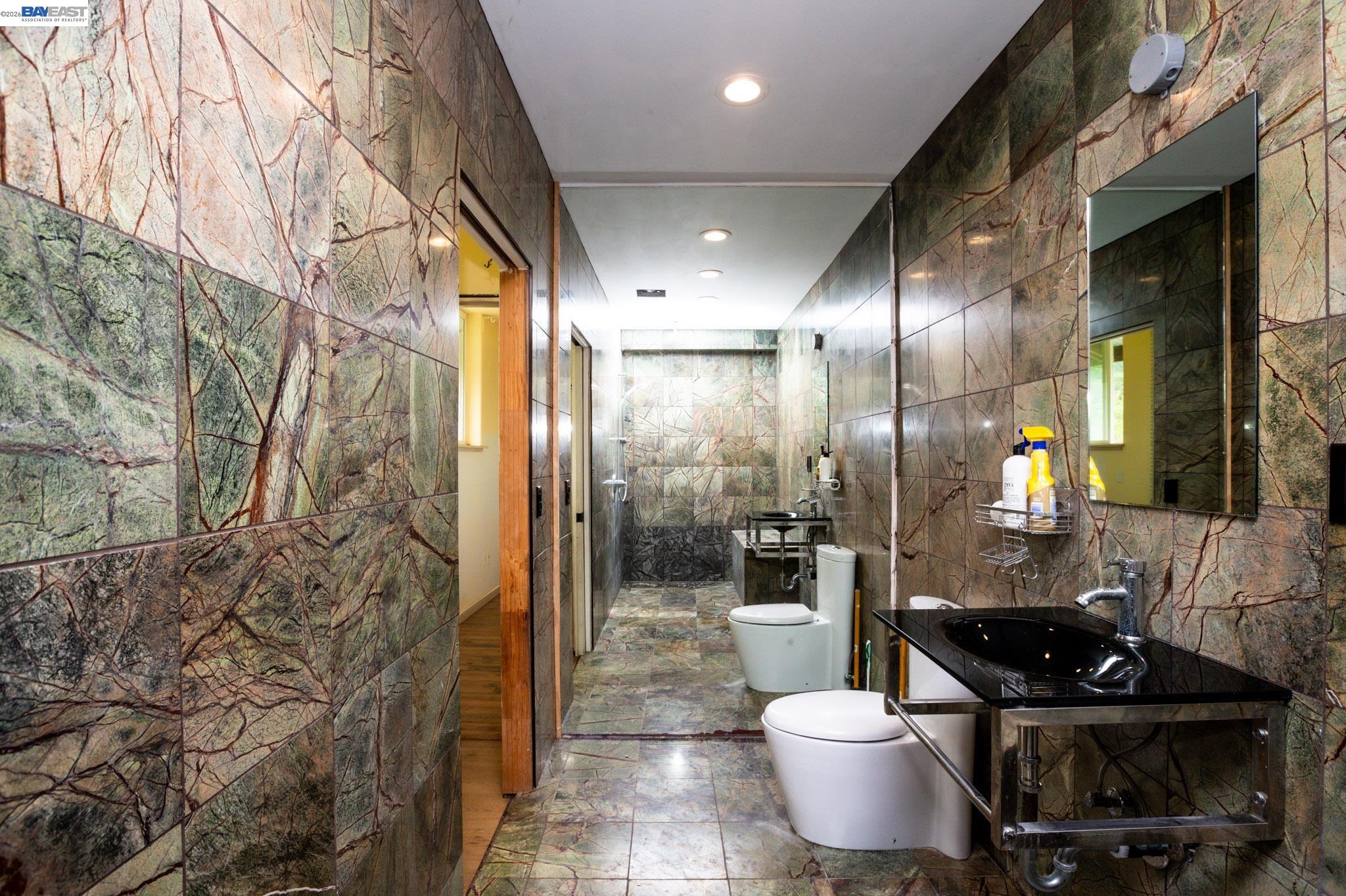 6115 Morgan Territory Road Clayton, CA 94517 - Photo 13 of 60 a bathroom with a sink and a mirror