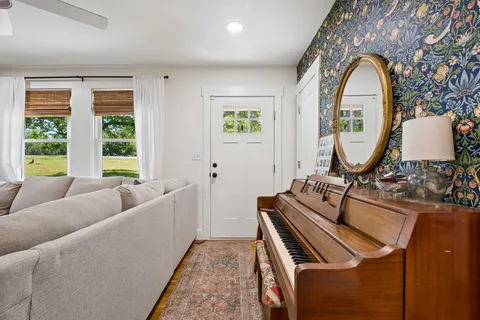 a living room with furniture and a window