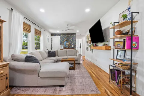 a living room with furniture and a flat screen tv