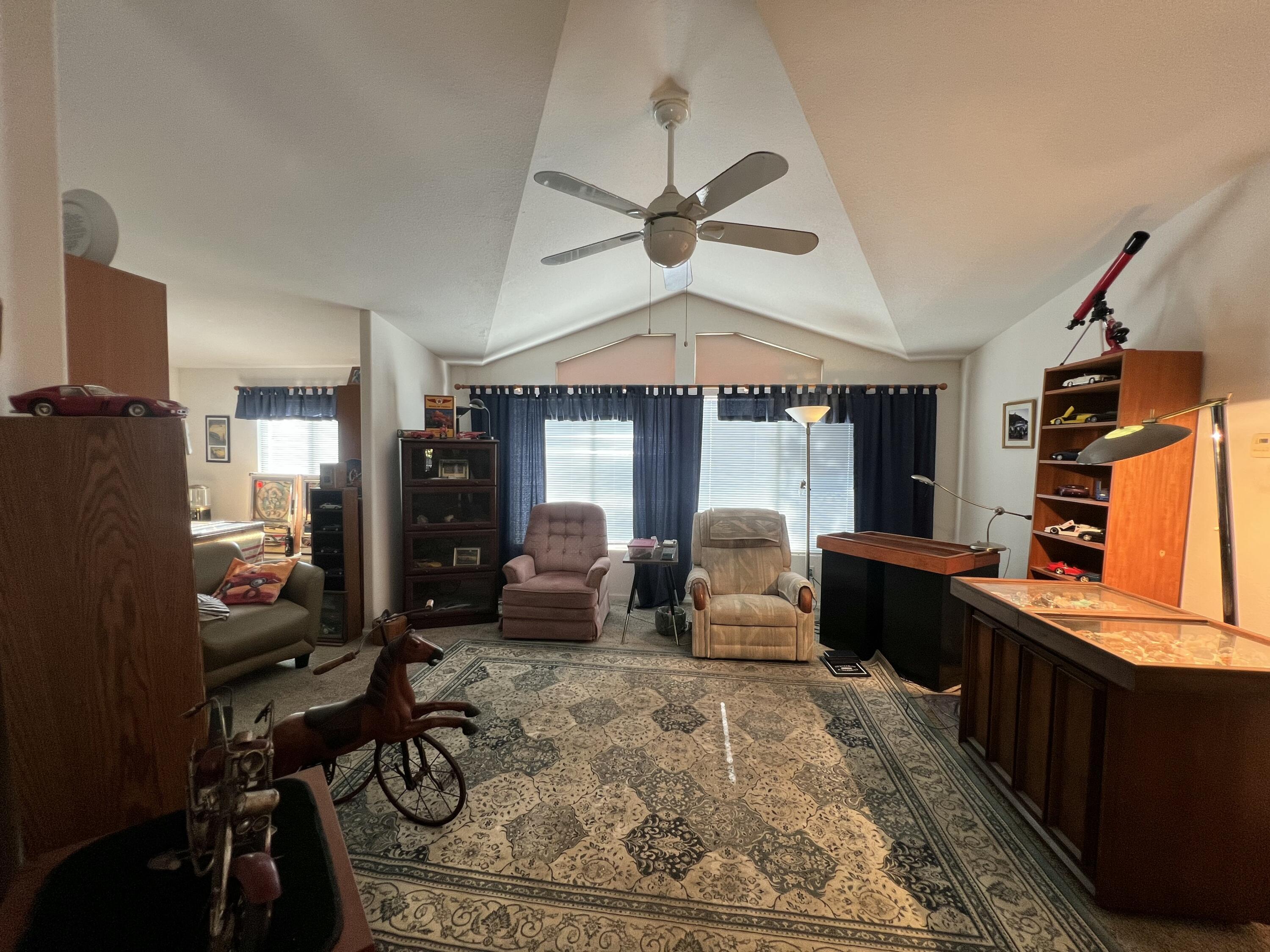 4722 Maple Trail Redding, CA 96003 - Photo 11 of 12 a living room with furniture windows and a flat screen tv