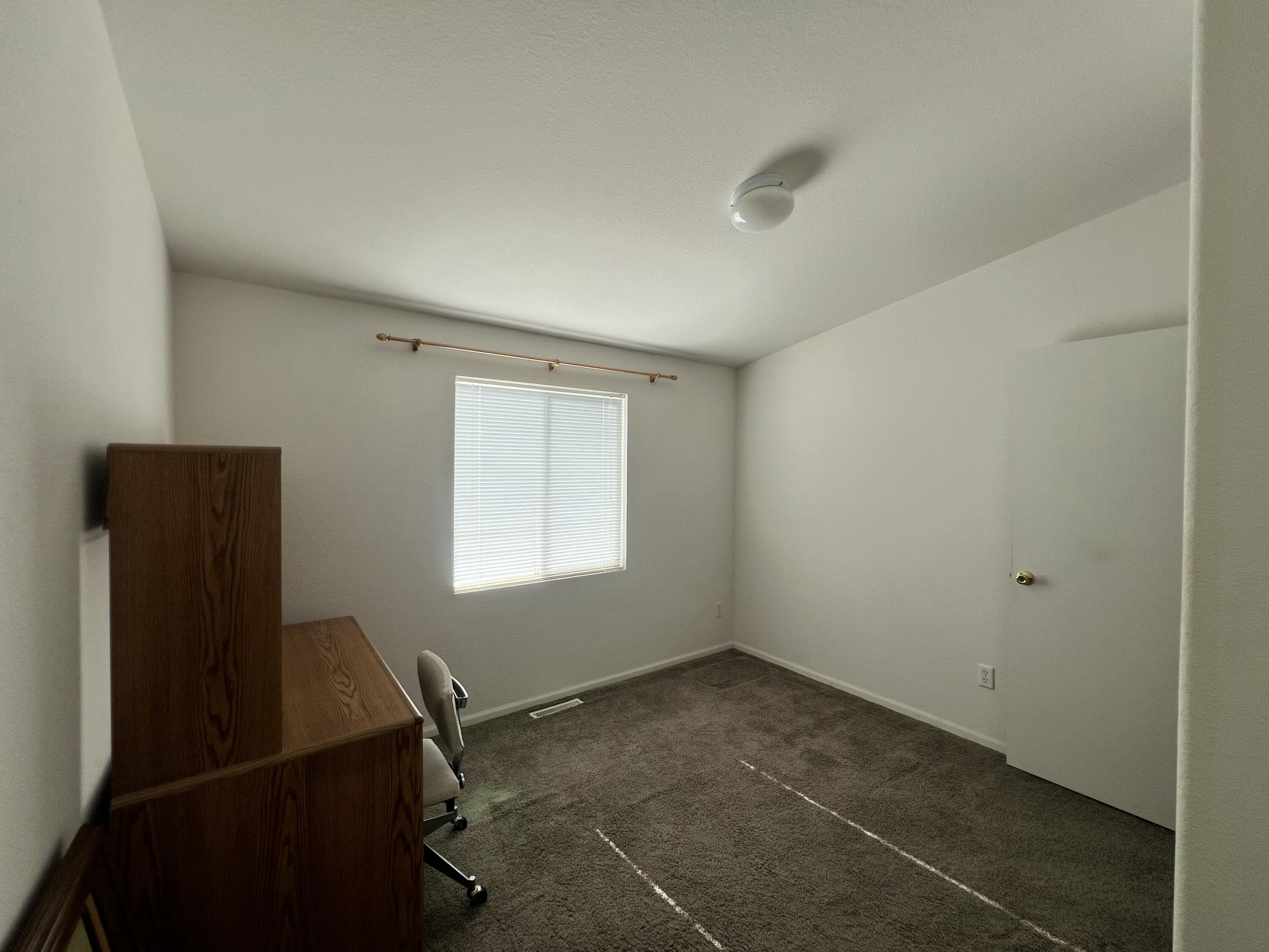 4722 Maple Trail Redding, CA 96003 - Photo 4 of 12 a view of a room with workspace and windows