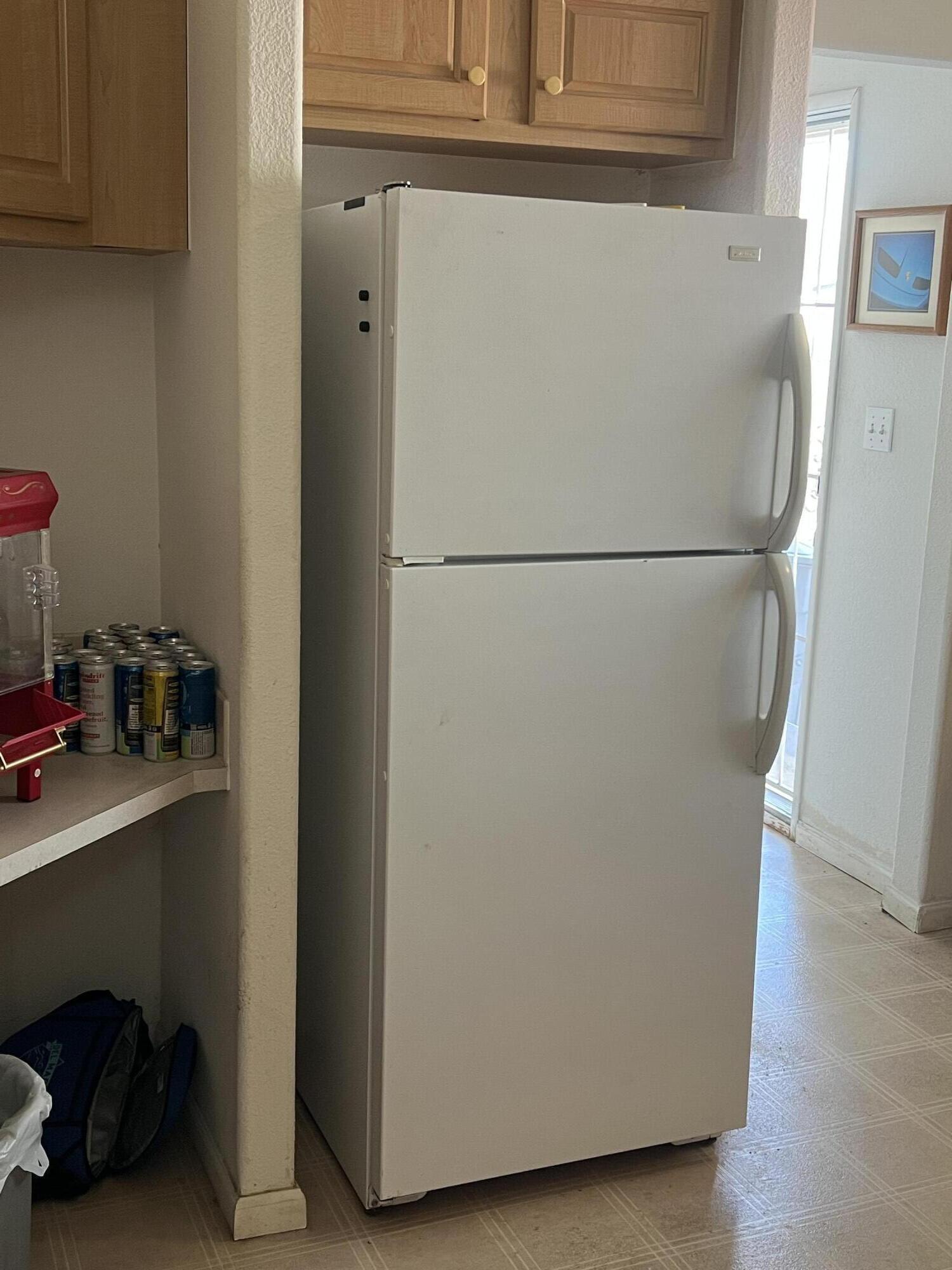 4722 Maple Trail Redding, CA 96003 - Photo 4 of 14 a white refrigerator freezer sitting in a kitchen