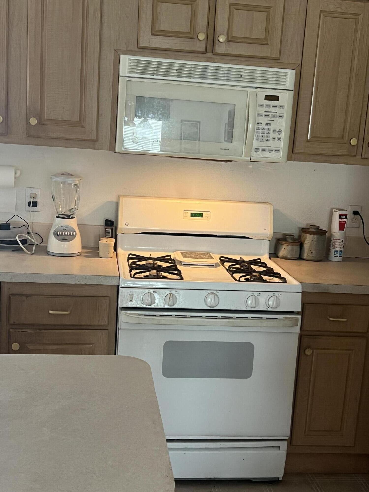 4722 Maple Trail Redding, CA 96003 - Photo 5 of 14 a stove top oven sitting inside of a kitchen