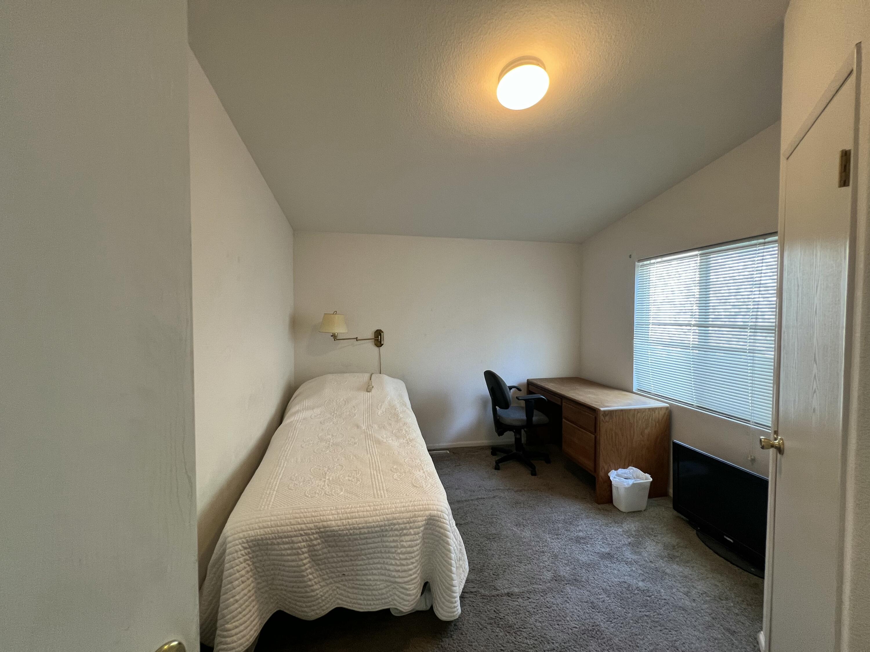 4722 Maple Trail Redding, CA 96003 - Photo 5 of 12 a bed room with a bed and a window
