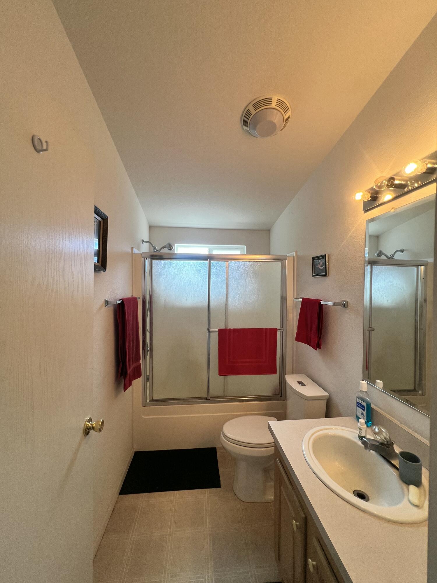 4722 Maple Trail Redding, CA 96003 - Photo 8 of 14 a bathroom with a sink and mirror with toilet