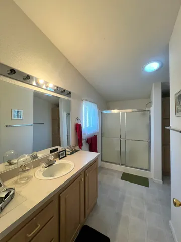 a bathroom with a sink double vanity and a mirror