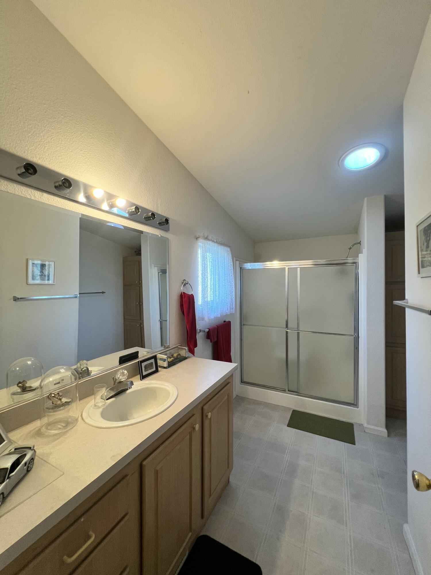 4722 Maple Trail Redding, CA 96003 - Photo 9 of 12 a bathroom with a sink double vanity and a mirror