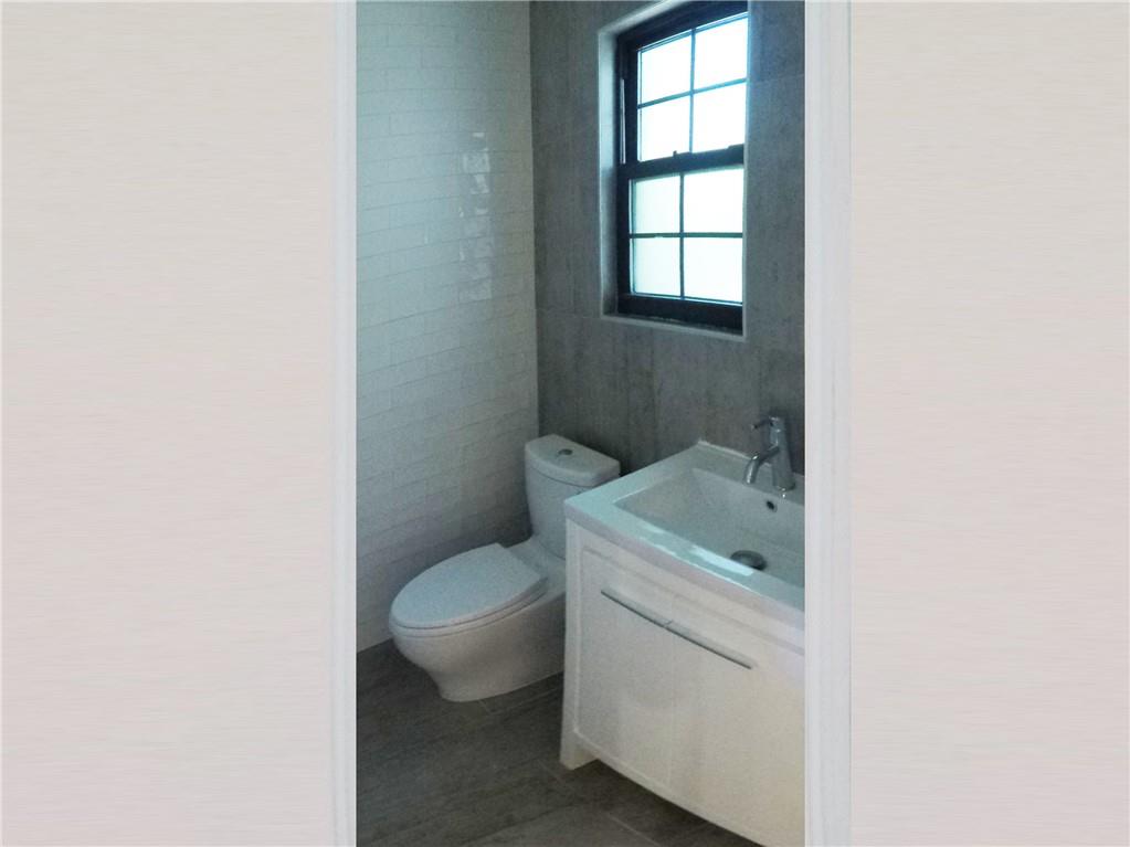 38 Troy Avenue Brooklyn, NY 11213 - Photo 15 of 16 a bathroom with a sink toilet and window
