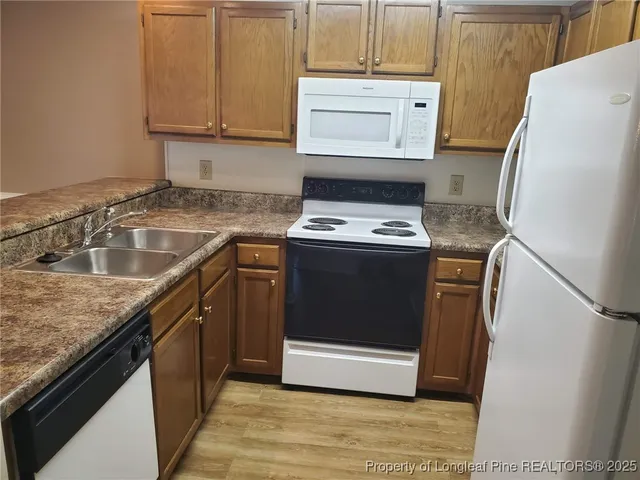 a kitchen with a stove and a microwave