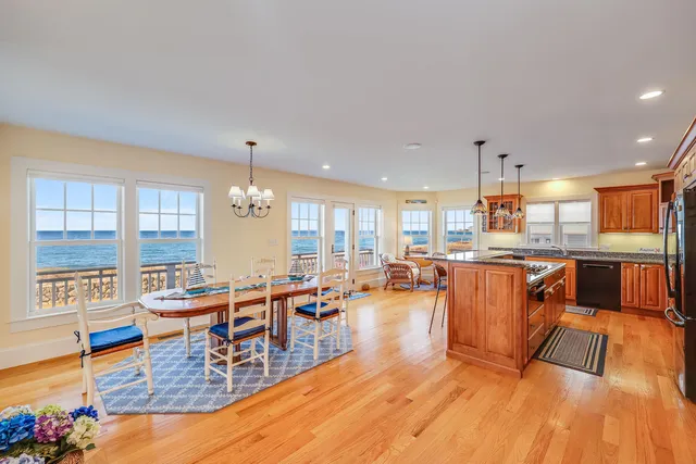 an outdoor space with dining table and chairs