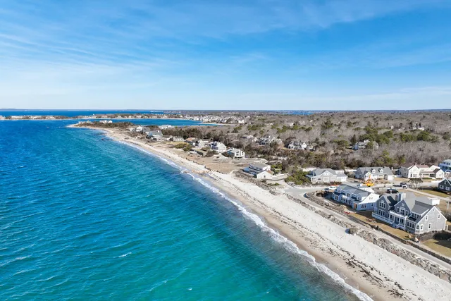 a aerial view of a house with a ocean view
