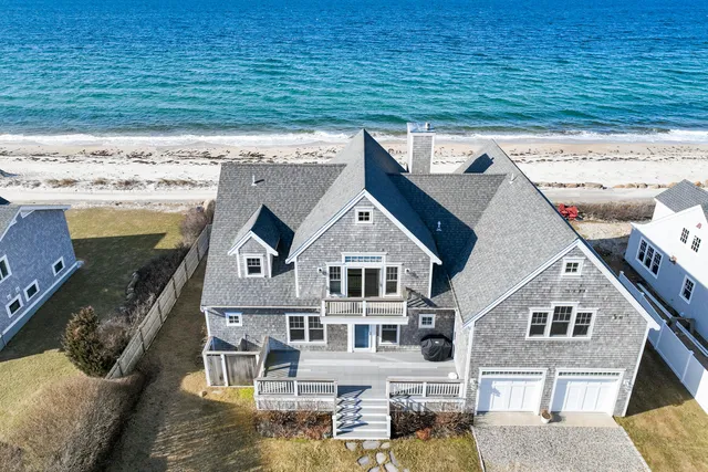 an aerial view of a house with a big yard