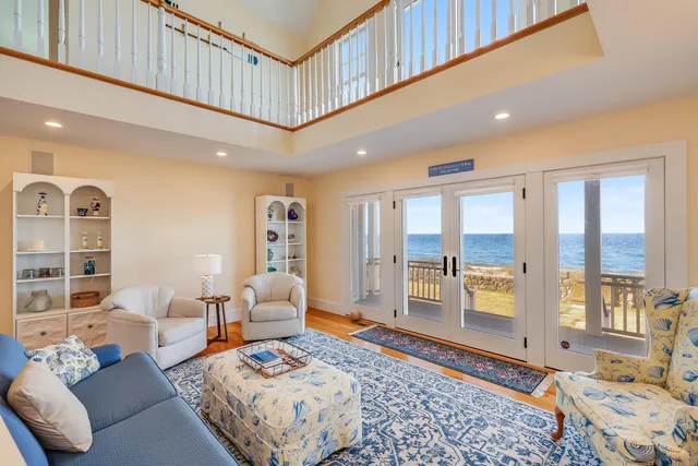 a spacious bedroom with a large bed and a couch