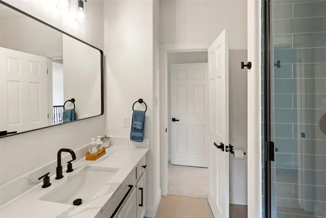 a bathroom with a sink and mirror