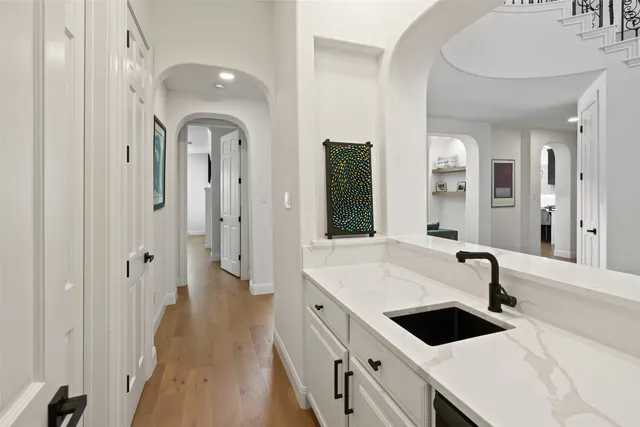 a kitchen with a sink and a refrigerator
